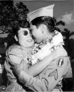 Returning Japanese-American soldier of US 442nd Regimental Combat Team weclomed by his sister, Honolulu, US Territory of Hawaii, 9 Aug 1946