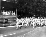 Japanese-American troops of 100th Infantry Battalion, US 442nd Regimental Combat Team marching during the Veterans Day Parade at Kapiolani Park, Honolulu, US Territory of Hawaii, 15 Aug 1946