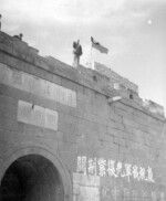 A soldier of the Chinese 18th Group Army (also known as the Communist 8th Route Army) atop the Zijinguan gate of the Great Wall of China, Yi County, Hebei Province, China, 2 Apr 1945