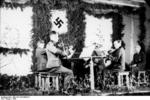 Musicians from the German Army conducting a concert with string instruments, Finland or Norway, 1943