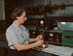 American woman working with electrical wiring at the Douglas Aircraft Company plant in Long Beach, California, United States, Oct 1942