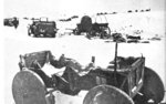 Wrecked vehicles and carts after a German retreat on the Eastern Front in Europe, winter of 1942-1943