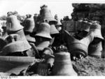 A collection of bells that Germany confiscated from all over Europe, piled up in Hamburg, Germany awaiting identification for their return to original owners, 1947, photo 1 of 2
