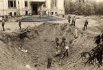 Bomb crater in front of Julianów Palace in Łódź, Poland, 1939, photo 1 of 3