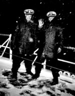 Two African-American US Coast Guard officers, Ensign J. J. Jenkins and Lt (jg) Clarence Samuels, aboard a USCG cutter in the North Atlantic, date unknown; note the wintry conditions on deck