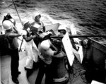 Five African-American US Coast Guardsmen manning a 20-mm Oerlikon AA autocannon aboard a frigate in the southwest Pacific, date unknown. L to R: J Wesley, L Haywood, W Watson, W Morton, O Lane