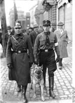 Berlin city police and a Nazi Party member on the streets of Berlin, Germany on 5 Mar 1933, which was an election day