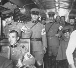 Japanese Army military policemen in a railway car during the Grand Military Exercise, Kagoshima Prefecture, Japan, 1935