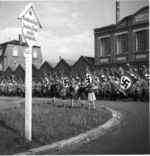 German children saluting Nazi Party members marching past them, Nürnberg, Germany, circa early Sep 1938