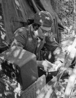 Soviet Army radioman receiving a Soviet Information Bureau communique, circa 1942