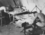 USAAF men working on aerial reconnaissance photographs, Saipan, Mariana Islands, 1945, photo 1 of 4