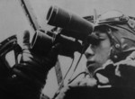 Japanese naval aviator observing the distance with binoculars, 1941-1943