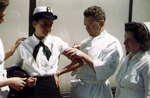 WAVES personnel getting vaccination from an US Navy doctor, circa late 1944
