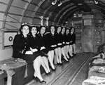 WAVES personnel traveling aboard a R4D-6 transport aircraft while en route to Naval Air Station, Olathe, Kansas, United States, 13 Nov 1944