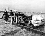 WAVES disembarking from a barge at Naval Air Station, Anacostia, Washington, DC, United States, 30 Oct 1943