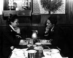 Ensign Frances Wills and Lieutenant (jg) Harriet Ida Pickens eating lunch at Northampton, Massachusetts, United States, circa Dec 1944; they were US Navy