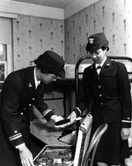 WAVES Lieutenant (jg) Harriet Ida Pickens and Ensign Frances Wills packing following graduation from the Naval Reserve Midshipmen
