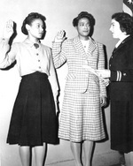 Frances Wills and Harriet Ida Pickens being sworn in as WAVES apprentice seamen by Lieutenant Rosamond D. Selle, New York City, New York, United States, Nov 1944
