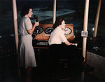 WAVES Specialist 3rd Class Nora Scott and Specialist 3rd Class Virginia Chenoweth at work at the control tower of Naval Air Station, Charleston, South Carolina, United States, spring 1945