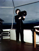 WAVES Specialist (Y) 3rd Class Doris M. Rolph signaling aircraft with a control tower signal lamp, Naval Air Station, Moffett Field, California, United States, circa 1944-1945