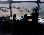 Scene in the control tower of Naval Air Station, Norfolk, Virginia, United States, overlooking a seaplane ramp full of OS2U Kingfisher aircraft, circa 1944-1945; note WAVES personnel