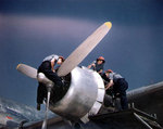 WAVES aircraft mechanics working on the port outboard Pratt & Whitney R-2000 engine of a R5D Skymaster aircraft, Naval Air Station, Oakland, California, United States, mid-1945