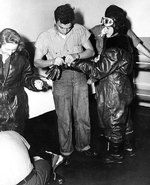 WAVES personnel putting on leather flight gear in preparation of a flight simulation,  Naval Air Station, Jacksonville, Florida, United States, 15 Oct 1943