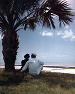 A US Navy sailor and a WAVES member gazing out over the beach at a Gulf of Mexico coast Naval Air Station, United States, circa 1945