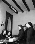 US Navy WAVES personnel and British Royal Navy sailors obtaining free theater tickets from New York