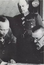 Mannerheim and Airo studying a map, circa 1941-1944; Heinrichs in background