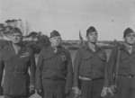 MGen A. Vandegrift, Col M Edson, 2Lt M. Paige, and Plt. Sgt. J. Basilone at US 1st Marine Division Medal of Honor ceremony, Balcombe, Australia, 21 May 1943, photo 2 of 2