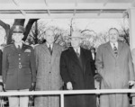 General Omar Bradley, Secretary of Defense Louis Johnson, US President Harry Truman, and another official reviewing an Army Day parade, 6 Apr 1949