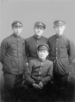 Students of Soongsil Middle School Chung Il-kwon (seated), Jang Jun-ha (left), Moon Ik-hwan (center), and Yun Dong-ju (right), 1935 or 1936