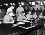 General Mark Clark signing the Korean War Armistice, 27 Jul 1953, photo 1 of 2
