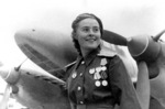 Soviet pilot Mariya Dolina posing in front of a Pe-2 bomber, circa 1944