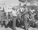 Lieutenant General James Doolittle being presented a plaque containing a fragment of a wrecked B-25 bomber that had participated in the Doolittle Raid, Miami Beach, Florida, United States, 19 Apr 1947