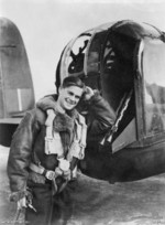 RAAF Flight Sergeant Roberts Dunstan posing outside of a tail gun position of a Lancaster bomber, Britain, 9 Sep 1943