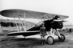 Ira Eaker with a P-12 fighter aircraft, 1930s