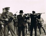 Major General Edward Brooks (behind Eisenhower) demonstrating M1 Carbines to Dwight Eisenhower, Winston Churchill, and Omar Bradley, England, United Kingdom, 15 May 1944, photo 1 of 2
