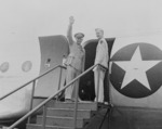 General Dwight Eisenhower waving to a crowd while boarding an aircraft, Washington National Airport, Arlington, Virginia, United States, 18 Jun 1945; note his son John Eisenhower