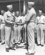 A flag previously raised on Iwo Jima, Japan was presented to Major General Graves Erskine for use in the filming of the movie Sands of Iwo Jima, 14 Jul 1949