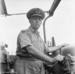 Commander Harold Farncomb at the bridge of cruiser HMAS Shropshire, 3 Jul 1945
