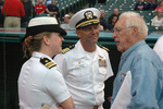 Bob Feller speaking with Lieutenant Commander Elizabeth Zimmermann and Captain Frank McCulloch, Jacob Field, Cleveland, Ohio, United States, 30 Aug 2006