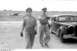 German Luftwaffe Major General Adolf Galland on an inspection in southern Italy, 1943; note Bf 109 fighter in background