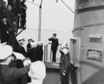 King George VI returning the salute of American servicemen aboard USS Augusta, Plymouth, England, United Kingdom, 2 Aug 1945; the monarch was visiting President Harry Truman aboard this ship