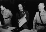 He Yingqin inspecting the Japanese surrender document at the Chinese Military Academy in Nanjing, China, 9 Sep 1945; note US representative General Megrow and General Gu Zuodong
