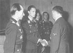 German pilots Hartmann Grasser, Heinrich Prinz zu Sayn-Wittgenstein (shaking hands with Hitler), Günther Rall, and Walter Nowotny with Adolf Hitler at Wolfsschanze, East Prussia, Germany, 22 Sep 1943