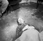 The body of Heinrich Himmler lying on the floor at British 2nd Army HQ after his suicide on 23 May 1945