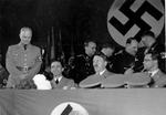 Joseph Goebbels and Adolf Hitler at a party, Berlin, Germany, 30 Oct 1936; note Josef Dietrich in background