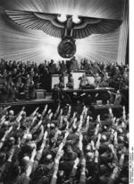 Adolf Hitler receiving salutes from the German Reichstag upon declaring war on the United States, Kroll Opera House, Berlin, Germany, 11 Dec 1941